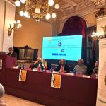 Il saluto del Delegato e il tavolo di relatori e premiati